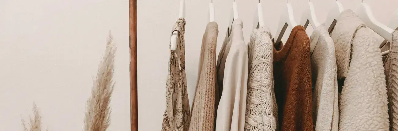 Women's clothes on hanger referencing a beautiful and stylish wardrobe