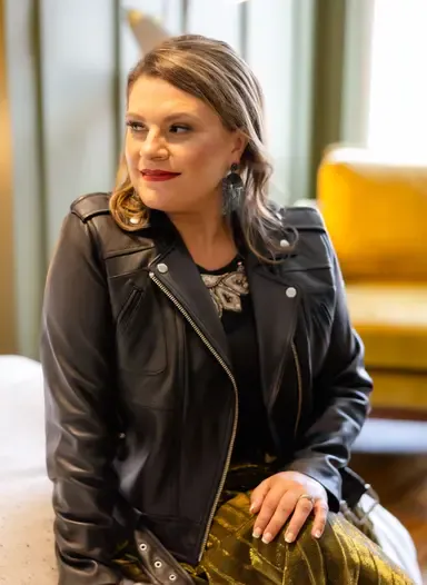 Personal photo of Michelle Glass in a leather jacket