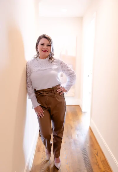 Michelle Glass stylist sitting in a hallway